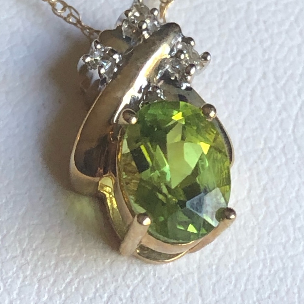 Peridot necklace 10 K gold with diamonds chips In original box